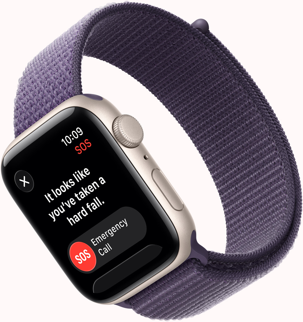 Apple Watch SE 3, casing aluminium, warna putih pucat metalik, pemberitahuan SOS Deteksi Jatuh, tombol panggilan darurat, eksterior sisi kanan, Digital Crown, mikrofon, tombol samping, tali jam, Loop Sport, warna ungu kabut
