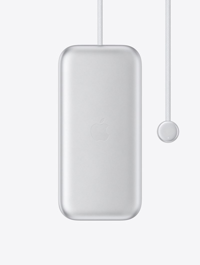 بطارية Apple Vision Pro، الجزء الخارجي، شعار Apple في الوسط، كابل طاقة مدمج مع موصل دائري في أحد الطرفين، مؤشر LED على الموصل