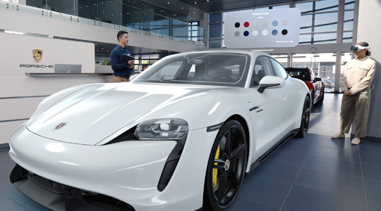A customer in a Porsche showroom wearing Apple Vision Pro views a 3D projection of a sports car and talks to an employee