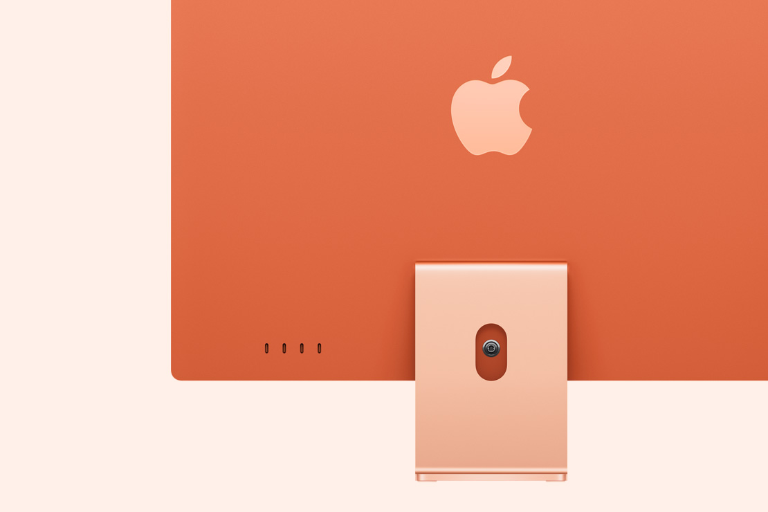 橙色 iMac 背面圖,突顯 4 個 USB-C 埠