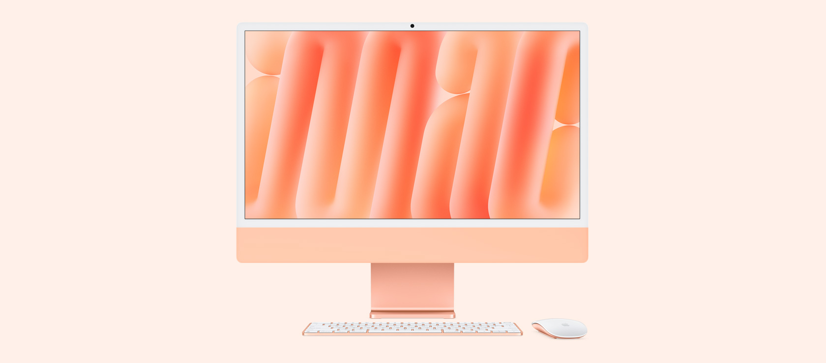 橙色 iMac 正面圖,展示同色系的滑鼠與鍵盤