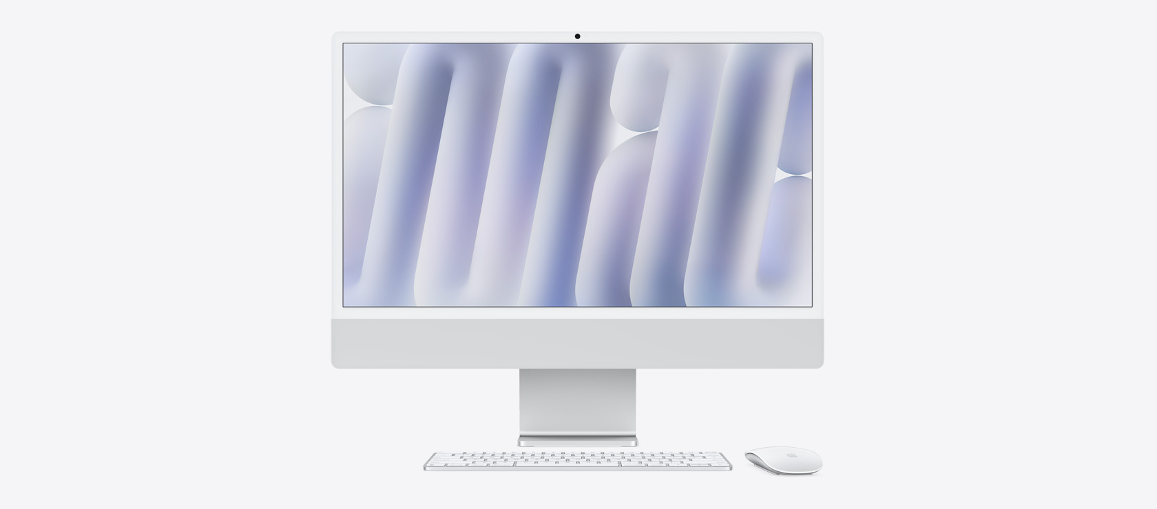 銀色 iMac 正面圖,展示同色系的滑鼠與鍵盤