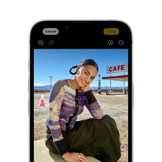 Apple Intelligence Clean Up tool highlighting a background object in a photo on iPhone 16e.
