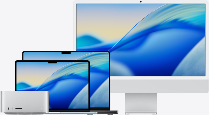 إحدى خلفيات نظام macOS Tahoe تظهر على شاشة مجموعة من موديلات Mac من اليسار إلى اليمين: Mac Studio، وMacBook Air مقاس 13 إنش باللون الأزرق السماوي، وMacBook Pro مقاس 14 إنش باللون الأسود الفلكي، وiMac مقاس 24 إنش باللون الفضي