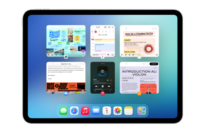 Un iPad, orientation paysage, affiche six fenêtres ouvertes disposées sur deux rangées, dont l’app Calendrier, l’app Notes, Apple Music et Safari