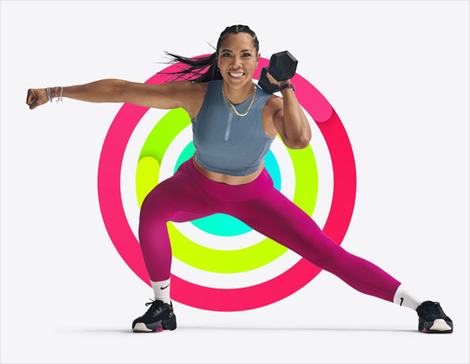 A person lifts weights in a side lunge position, Activity rings form background